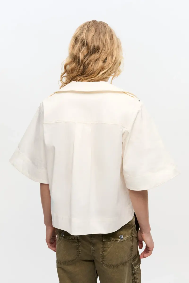 Elfenbeinfarbene Bluse aus Stretch-Baumwolle Elfenbeinfarbene Bluse aus Stretch-Baumwolle