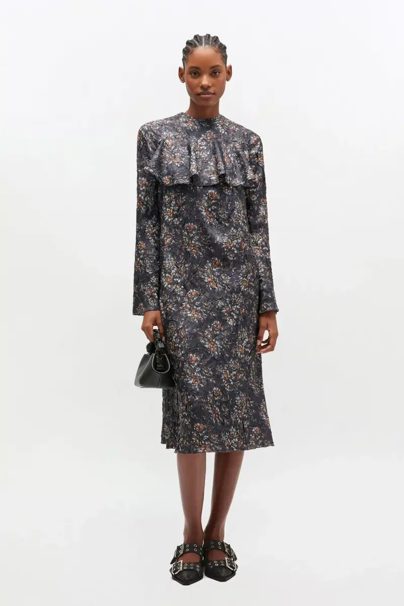 Schwarzes Rüschenkleid mit Blumenmuster